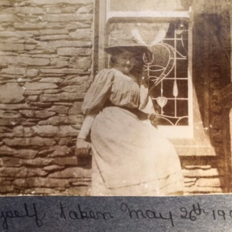 The stain glass window can still be seen in the background, which still exists today